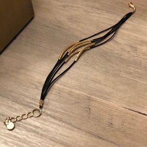 Black string/gold tubes adjustable bracelet